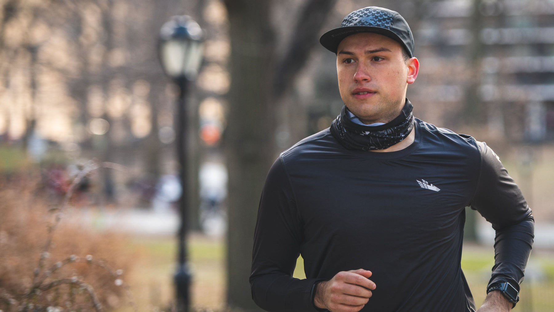 Runner wearing a hat and buff as part of our Hats and Accessories collection